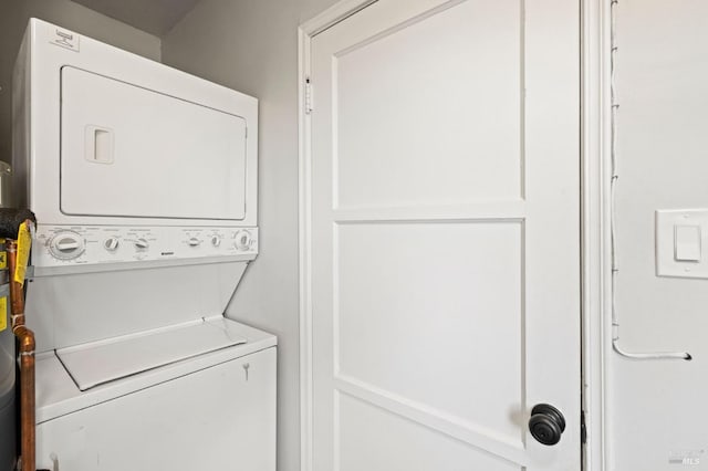 clothes washing area with stacked washer / drying machine