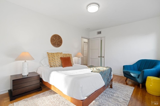 bedroom featuring hardwood / wood-style flooring