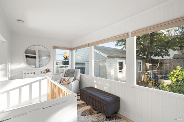 sunroom / solarium featuring a healthy amount of sunlight