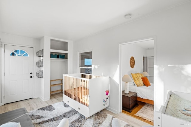 bedroom with light wood-type flooring