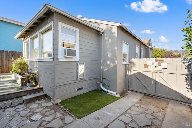 view of home's exterior featuring cooling unit