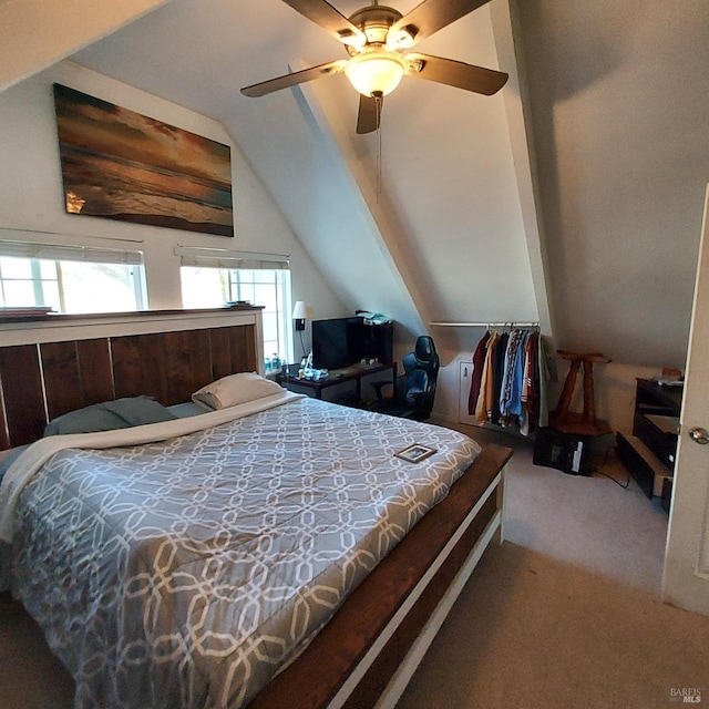 bedroom featuring carpet, lofted ceiling, and ceiling fan