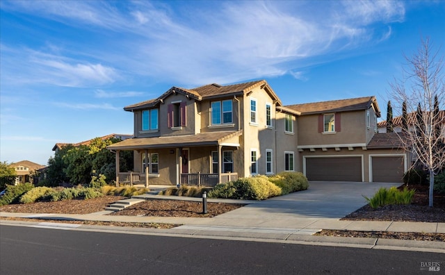 view of front of property with a porch and a garage