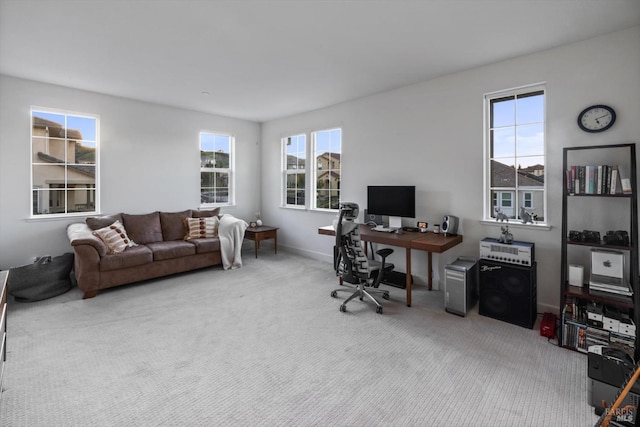 office area with plenty of natural light and carpet floors