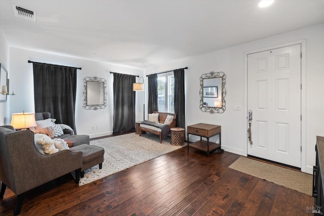 living room with dark hardwood / wood-style floors