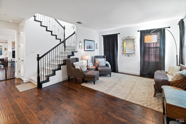 living room with dark hardwood / wood-style floors