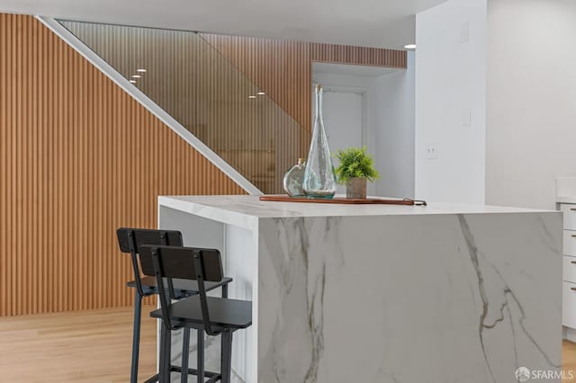 bar featuring light wood-type flooring