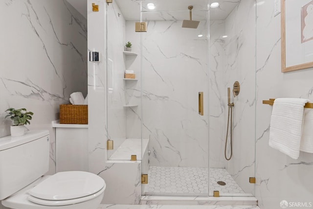 full bathroom featuring a marble finish shower, toilet, and stone wall