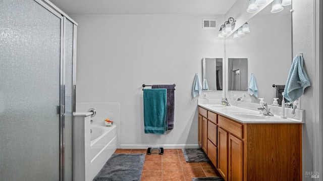 bathroom with vanity, tile patterned floors, and plus walk in shower