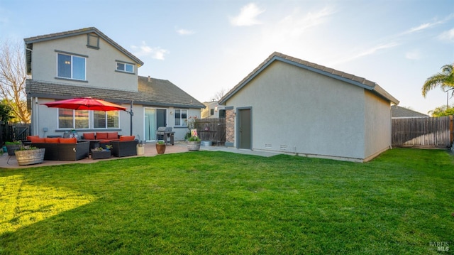 rear view of house featuring an outdoor living space, a yard, and a patio area