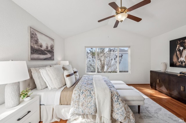 bedroom featuring vaulted ceiling, ceiling fan, and light hardwood / wood-style floors