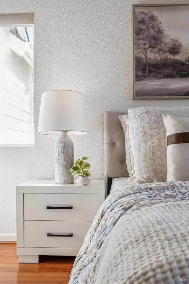 bedroom with light hardwood / wood-style flooring