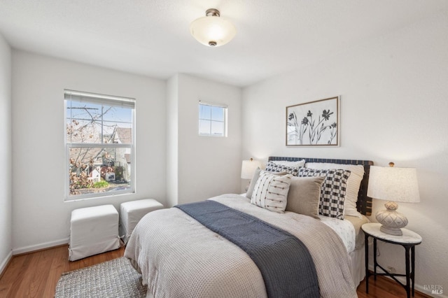 bedroom with hardwood / wood-style floors