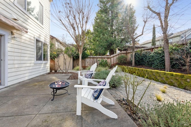 view of patio featuring an outdoor fire pit