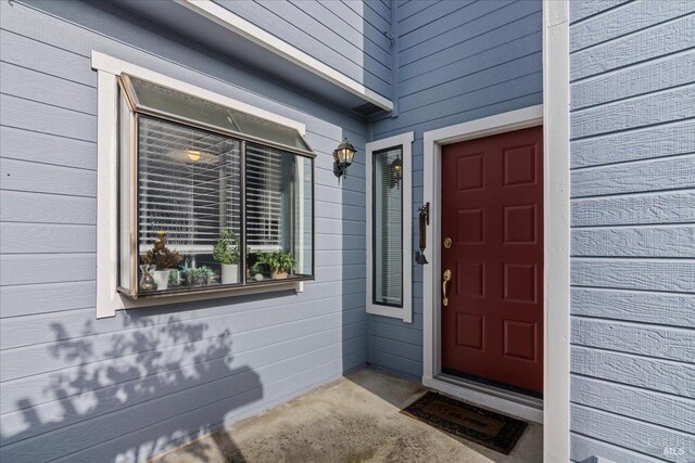 1782 Devonshire Dr, Benicia, CA 94510 - view of front of home with driveway, an attached garage, and brick siding