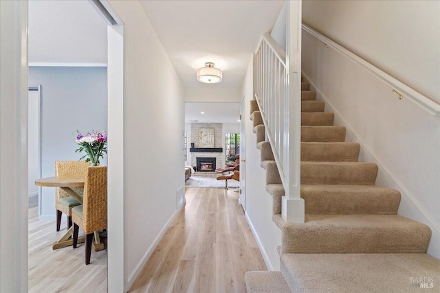 1782 Devonshire Dr, Benicia, CA 94510 - foyer entrance with stairs, light wood-style floors, a fireplace, and baseboards