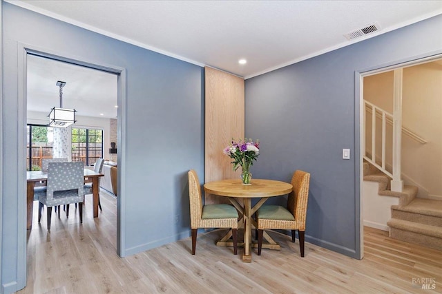 1782 Devonshire Dr, Benicia, CA 94510 - dining room featuring stairway, light wood-style flooring, a chandelier, baseboards, and recessed lighting