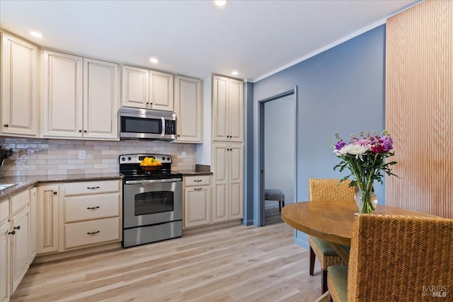 1782 Devonshire Dr, Benicia, CA 94510 - kitchen featuring appliances with stainless steel finishes, decorative backsplash, light wood finished floors, recessed lighting, and ornamental molding
