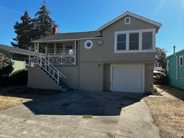 view of front of home featuring a garage and covered porch