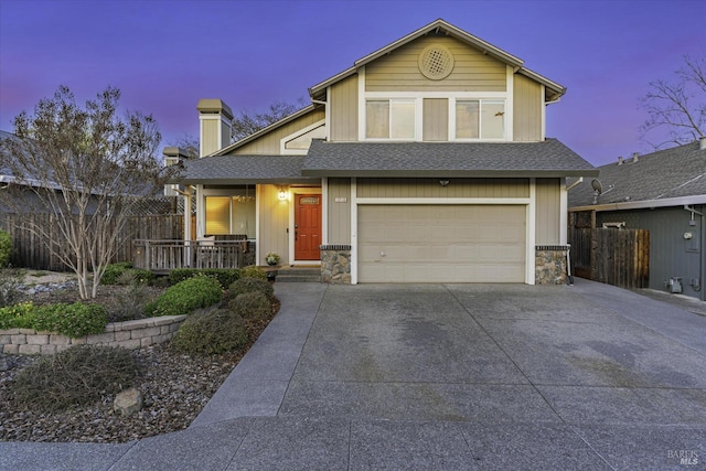 view of front of property featuring a garage and a porch