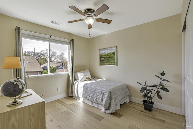 bedroom featuring ceiling fan and light wood-type flooring