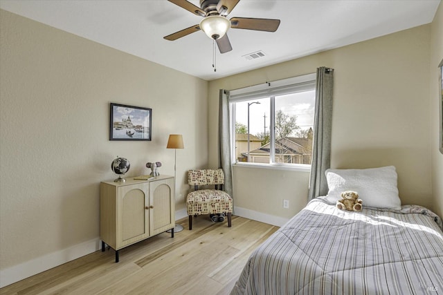 bedroom featuring ceiling fan and light hardwood / wood-style floors