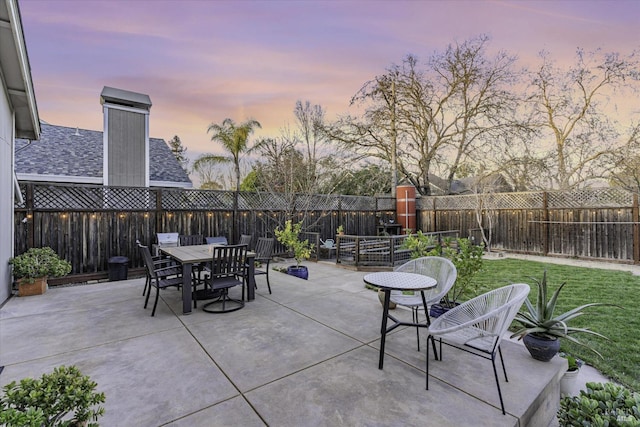 patio terrace at dusk with a yard