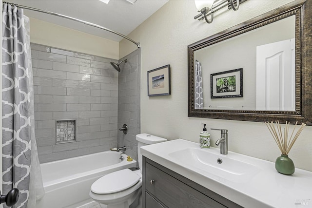 full bathroom featuring vanity, shower / bath combination with curtain, and toilet