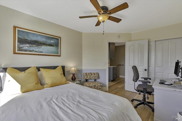 bedroom featuring ceiling fan, light hardwood / wood-style floors, and a closet