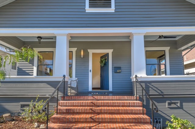 doorway to property with covered porch and ceiling fan