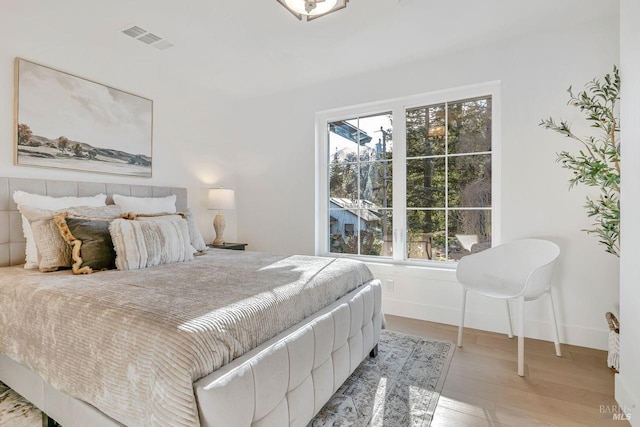 bedroom with light hardwood / wood-style flooring