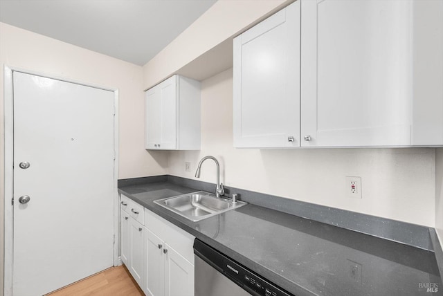 kitchen with white cabinetry, sink, light hardwood / wood-style flooring, and dishwasher