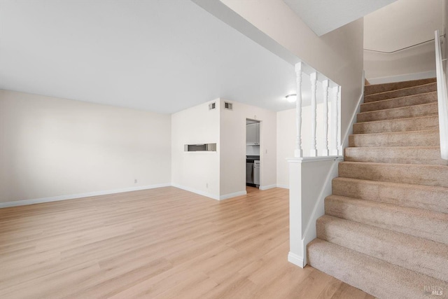 stairway with wood-type flooring