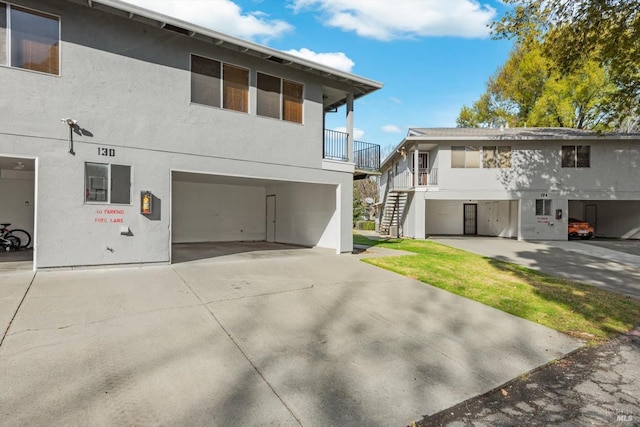 back of house featuring a garage