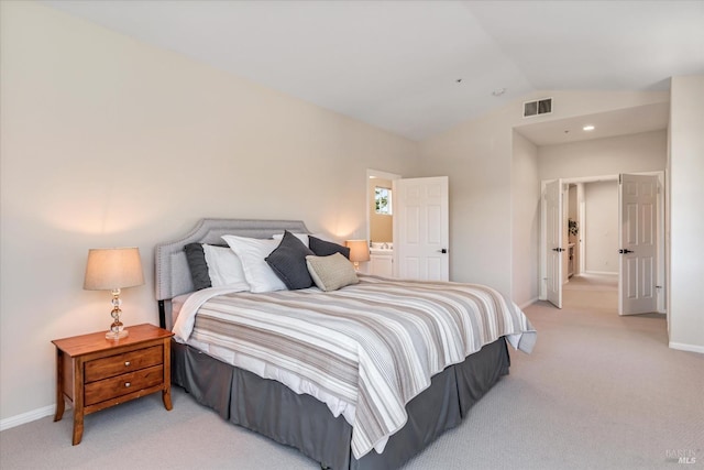 carpeted bedroom with vaulted ceiling