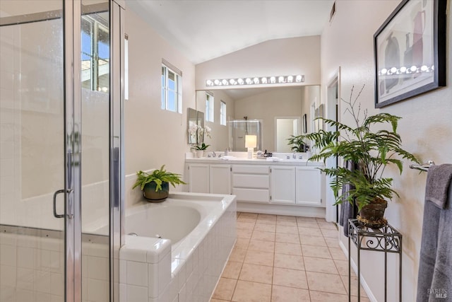 bathroom featuring tile patterned floors, lofted ceiling, plus walk in shower, and vanity