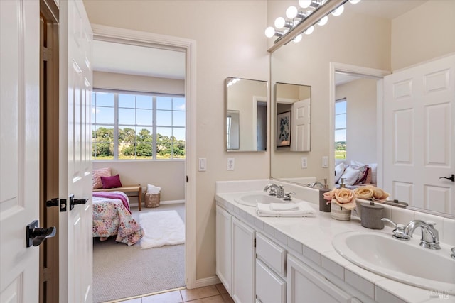 bathroom with tile patterned flooring and vanity