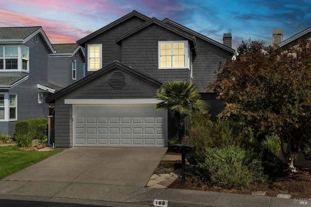 view of front of property with a garage