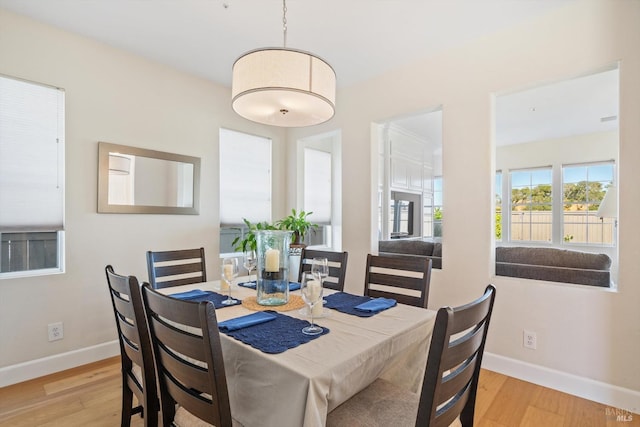 dining area featuring light wood-type flooring