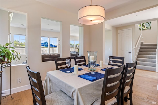 dining space featuring light hardwood / wood-style flooring