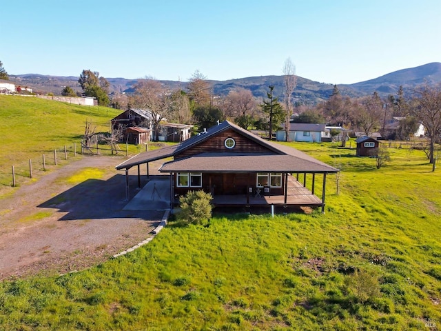 exterior space featuring a rural view and a mountain view