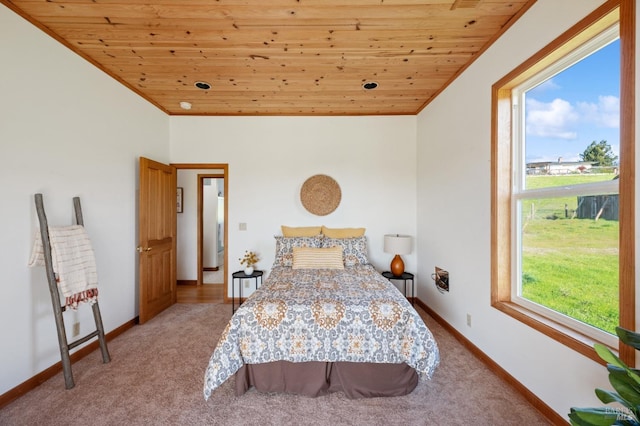 bedroom with wood ceiling, lofted ceiling, and carpet floors