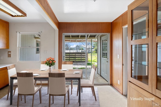 dining area with wood walls