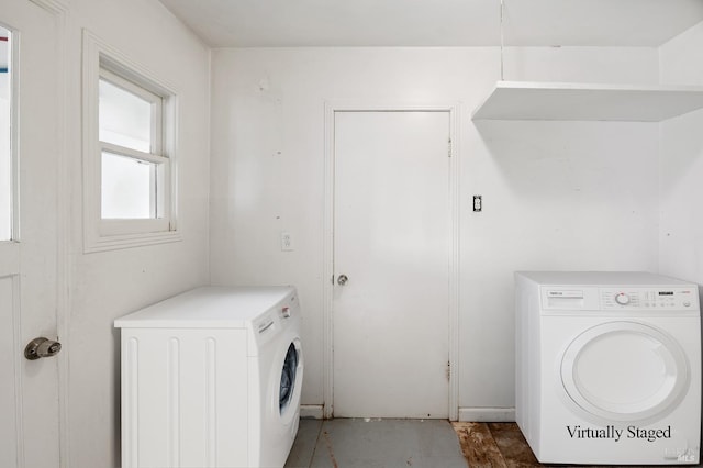 washroom featuring washing machine and dryer