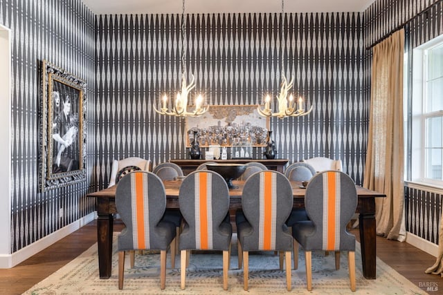 dining room with baseboards and wood finished floors