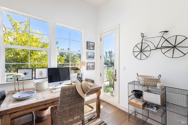 home office featuring baseboards and light wood-style floors