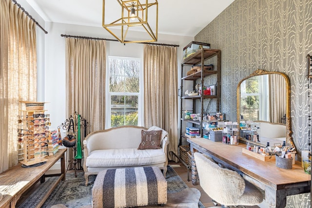 sitting room featuring wallpapered walls