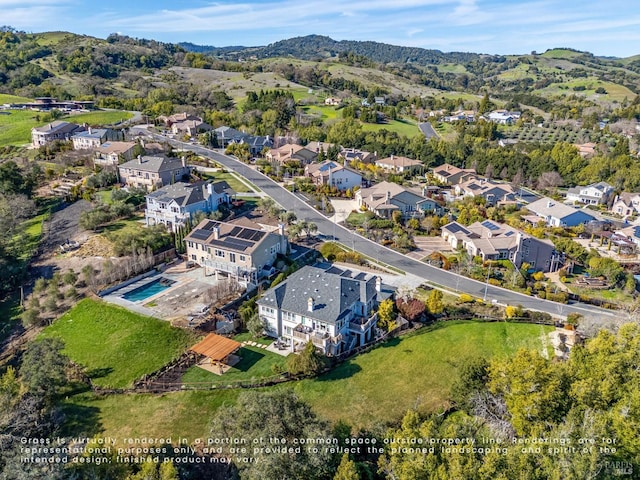 drone / aerial view with a residential view and a mountain view