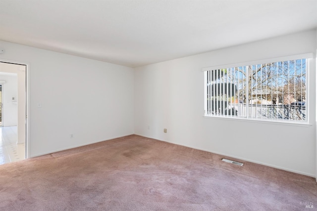 empty room featuring carpet floors