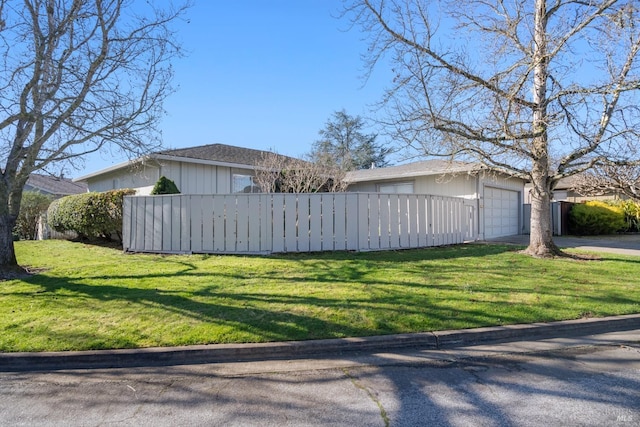 view of property exterior featuring a yard and a garage